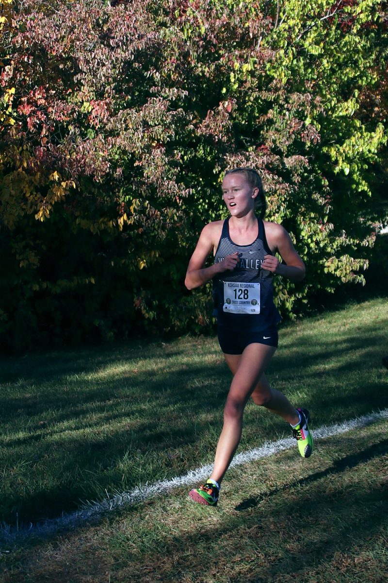 Staying strong, junior Charlotte Caldwell strides down the hill.