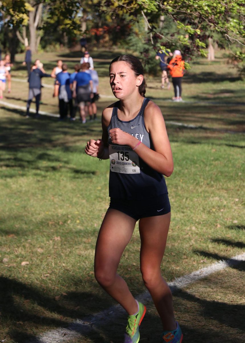 Looking forward, sophomore Paige Roth runs to the finish. 