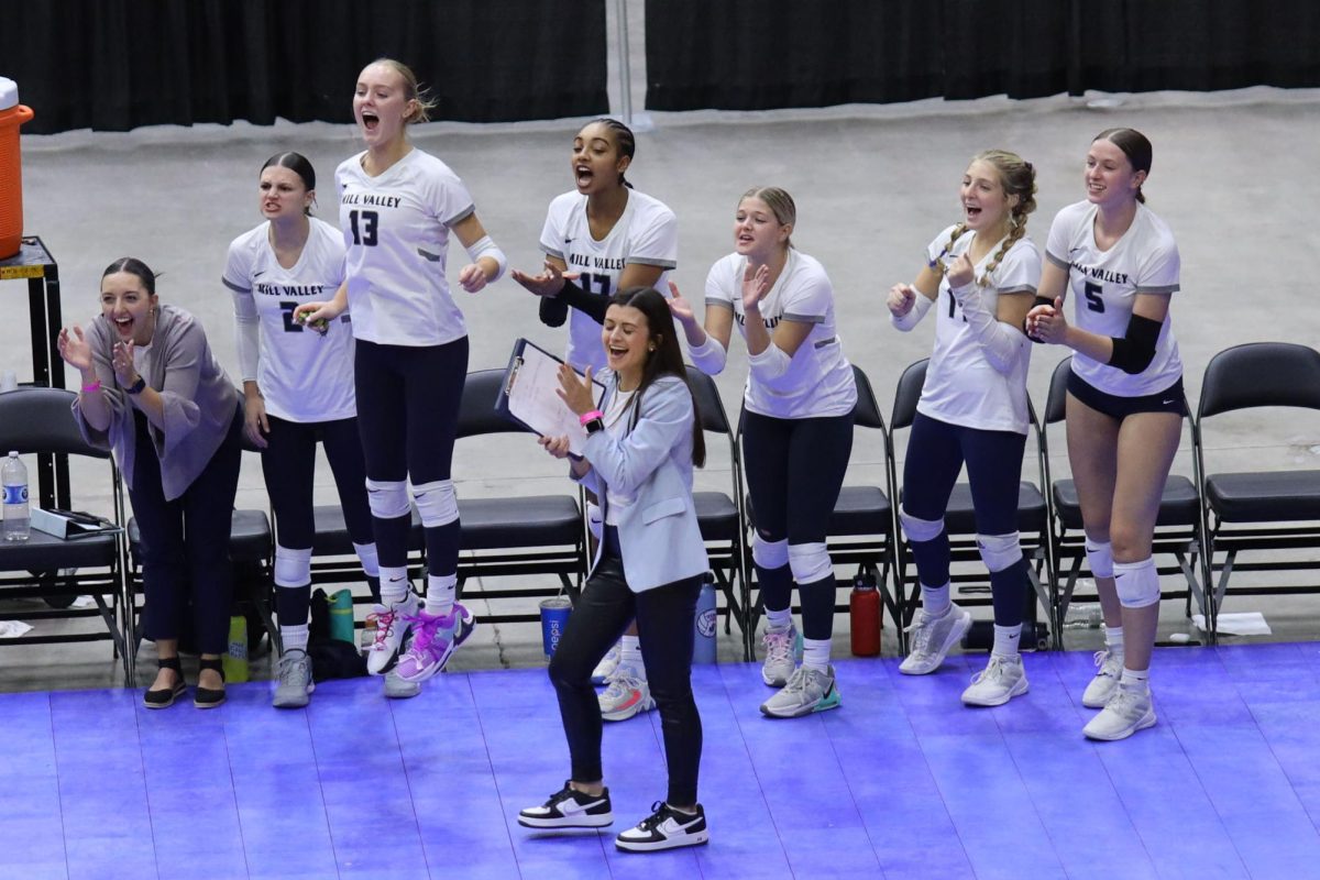 The team celebrates after a point-winning play by their teammates. 
