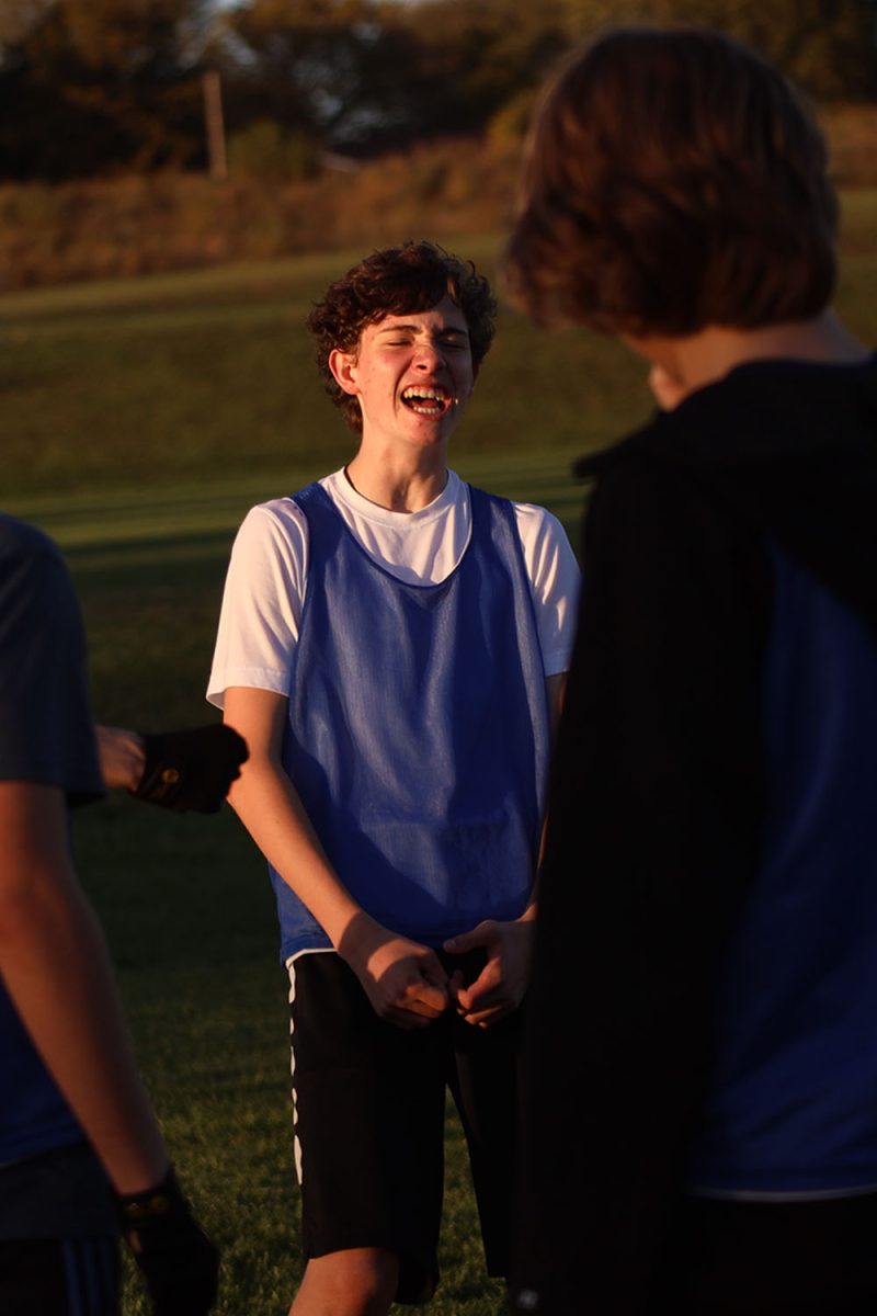 Cheering, sophomore Ethan Culver gets hyped for the game.