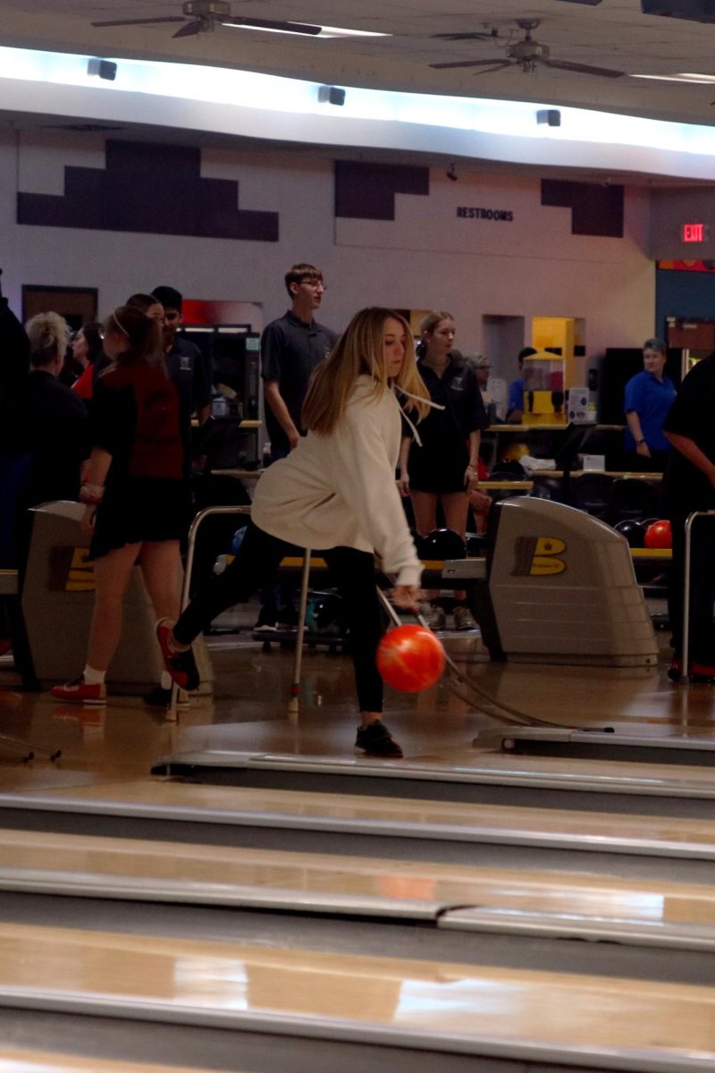 While focusing, senior Reagan Roberts tries to knock down the bowling pins.