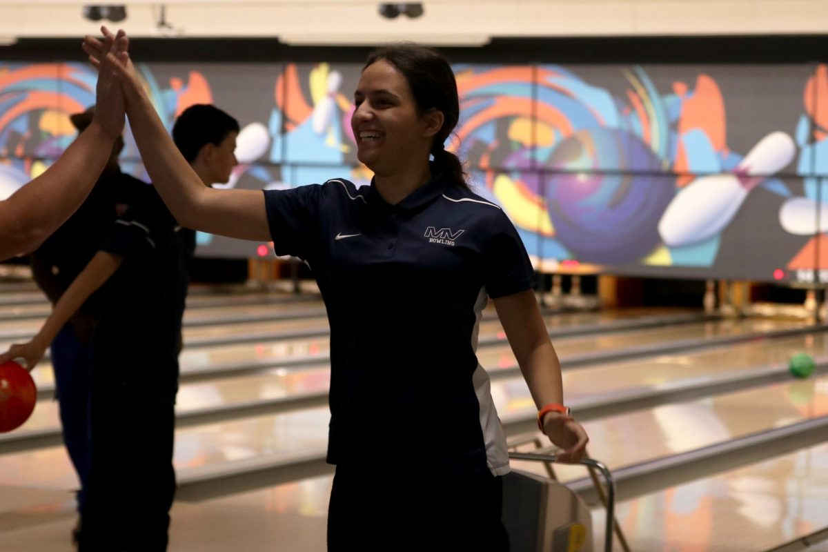 Senior Sireen Fraitekh celebrates after bowling a strike.