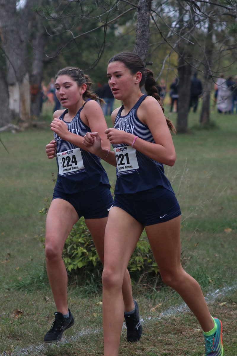 Running together, senior Kynley Verdict and sophomore Paige Roth focus on whats ahead.