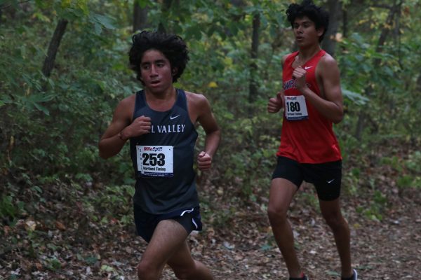 Racing through the woods, junior Yazid Vazquez pushes to beat his competition.