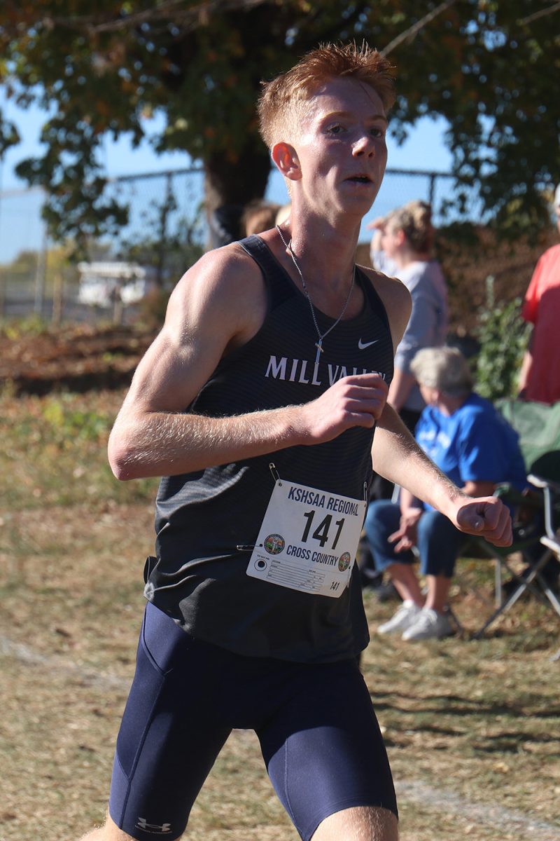 Striding out, senior Wil Lehan pushes himself to finish the race.