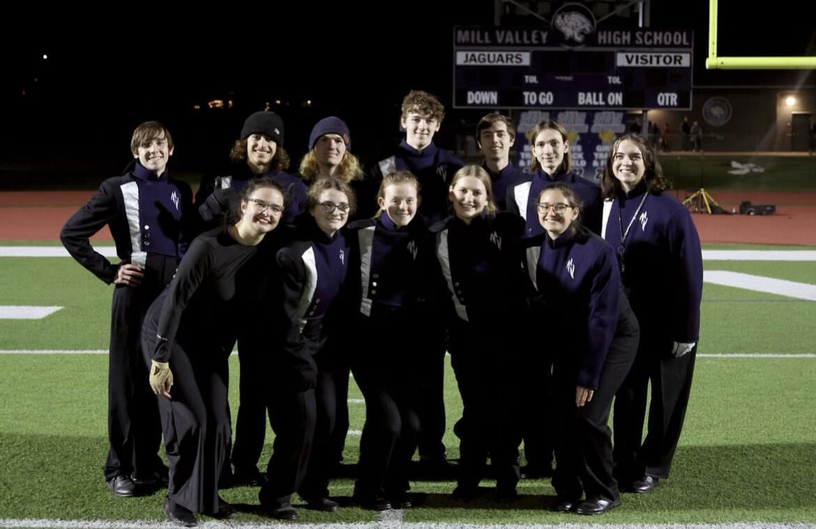 The senior members of the marching band pose at the football game before Central States Marching Festival Friday, Oct. 13.