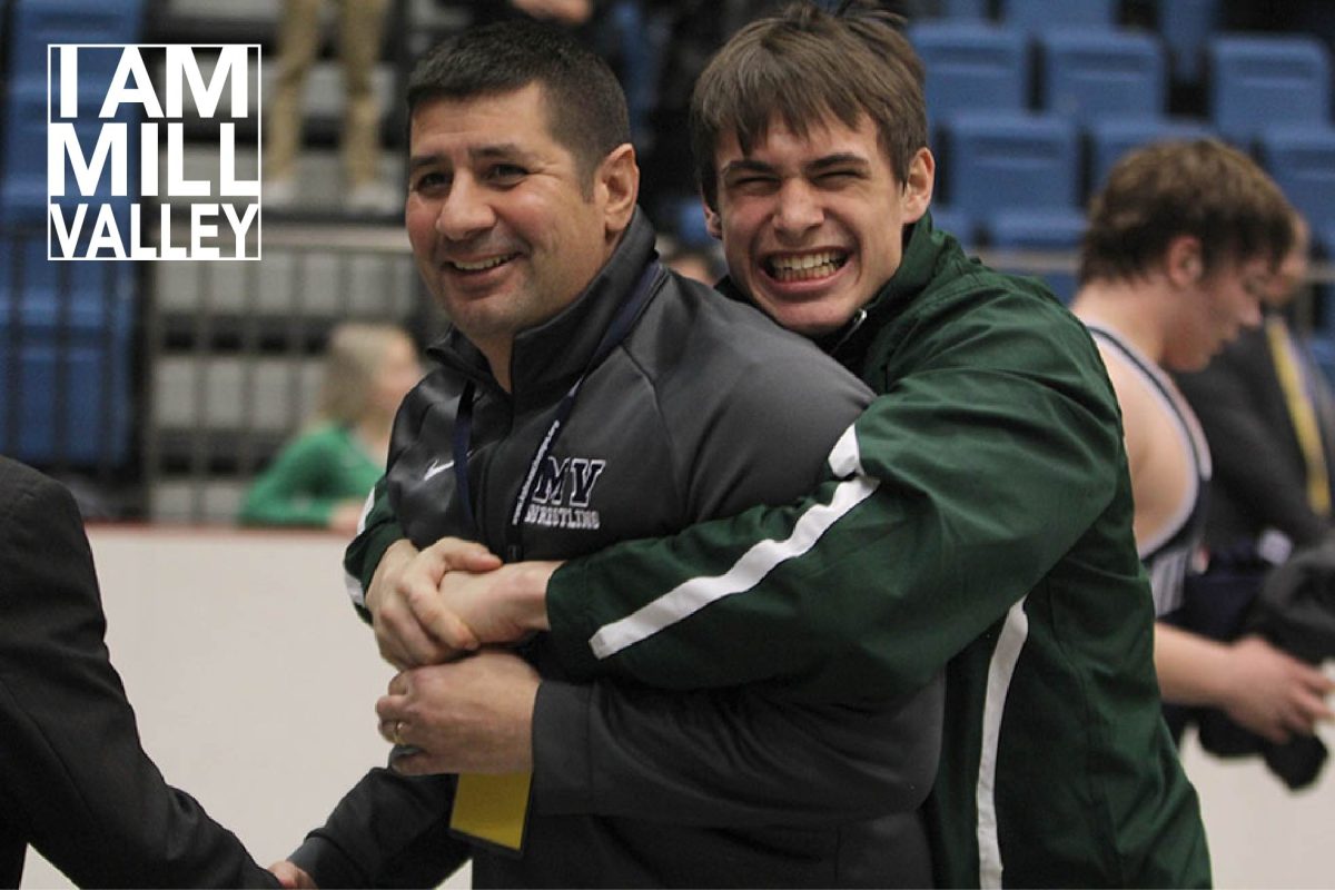 After graduate Ethan Kremer won a state title, in February 2019, a member of the Derby wrestling team congratulates head wrestling coach Travis Keal.