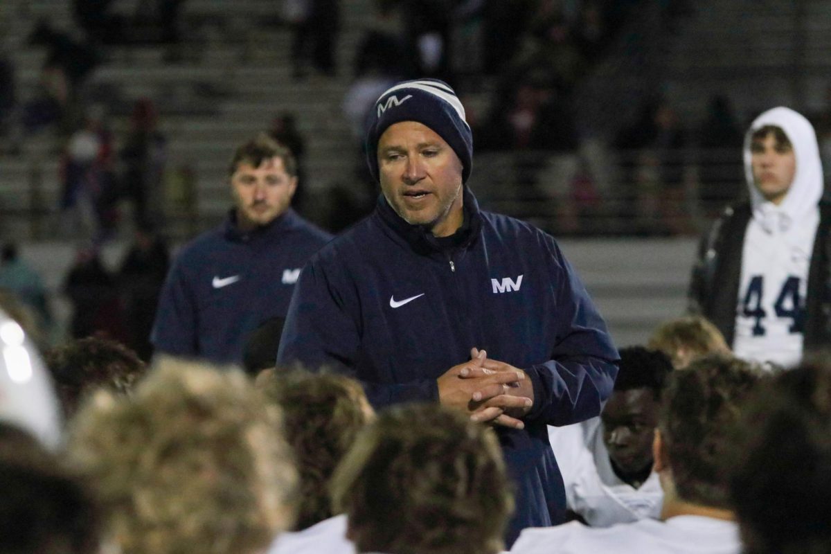 After the game, head coach Joel Applebee talks to  the team. 