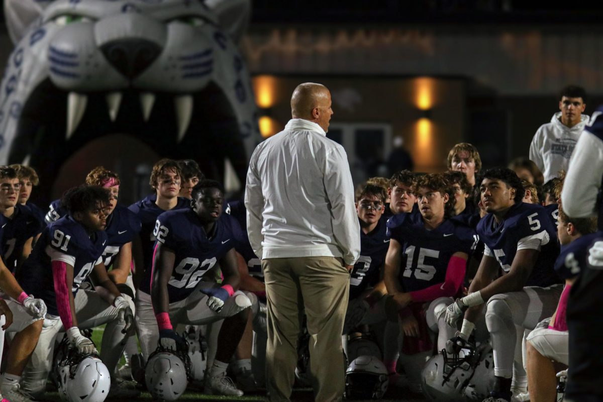 Addressing the team, head coach Joel Applebee gives his postgame speech. 