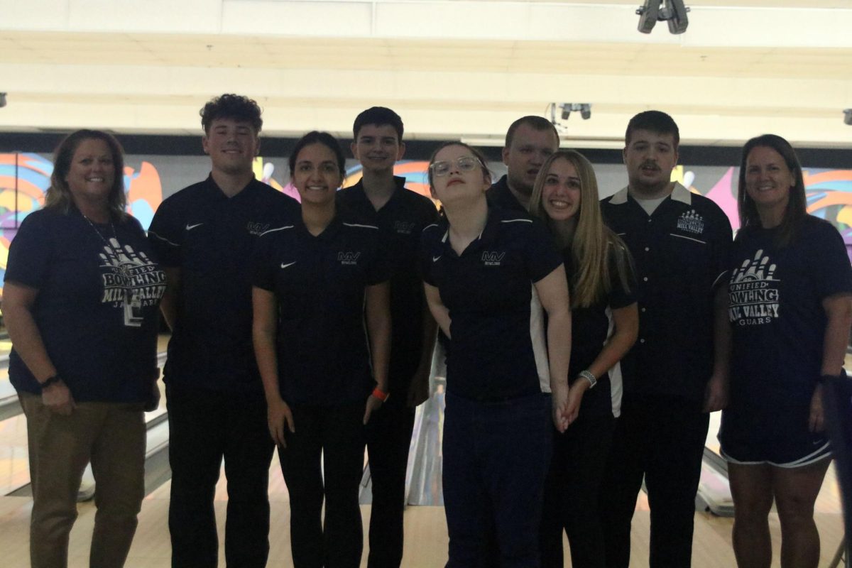 After their games, the unified bowling team smiles and poses. 