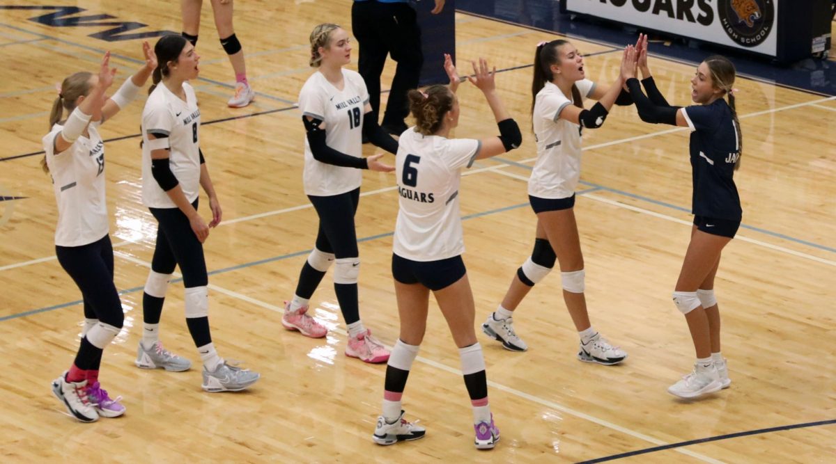 After scoring, the team comes together in celebration.