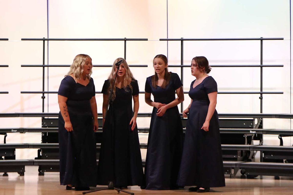The+girls+quartet+sings+together+at+the+choir+concert+Wednesday%2C+Oct.+25.+The+quartet+consists+of+seniors+McKinley+Graves%2C+Violet+Hentges%2C+Grace+Cormany+and+Sarah+Coleman.+