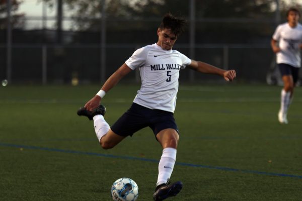 Focused on the ball, senior Roman Alvardo gets ready to take a kick. 
