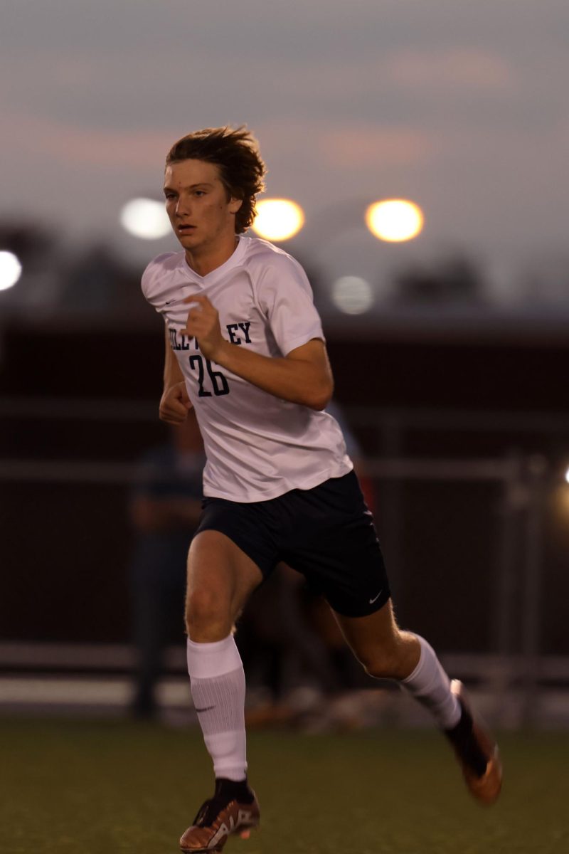 Dedicated, sophomore Kamdon Dick runs after the ball. 
