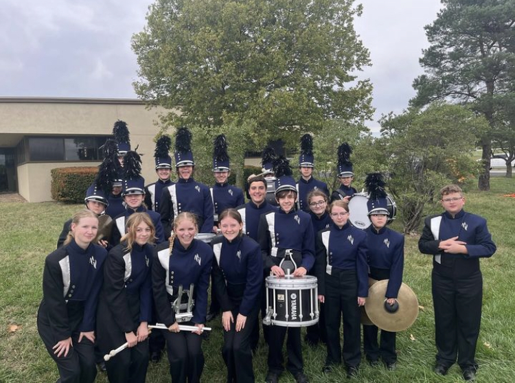 The drumline poses at the Emporia State Marching Festival where they received the Outstanding Drumline Award Wednesday, Oct. 4.