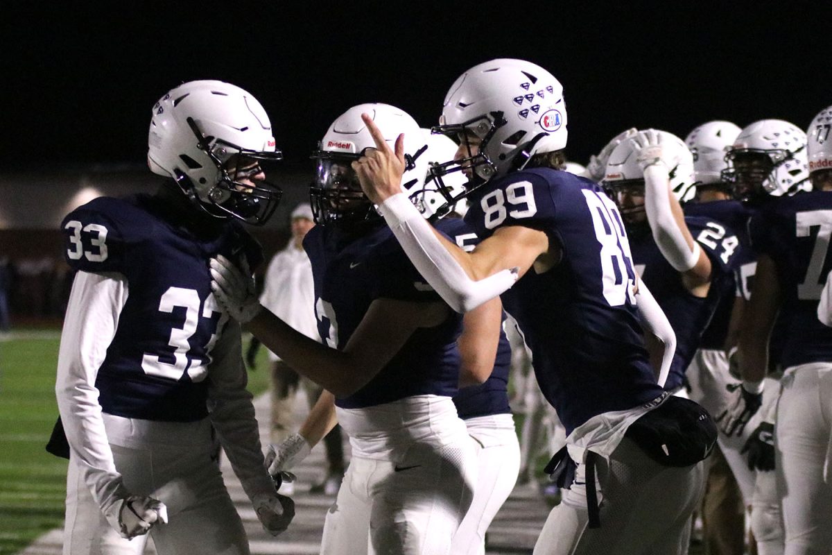 Sophomore Reece Riedel and senior wide receiver Reid Grier celebrate a play.