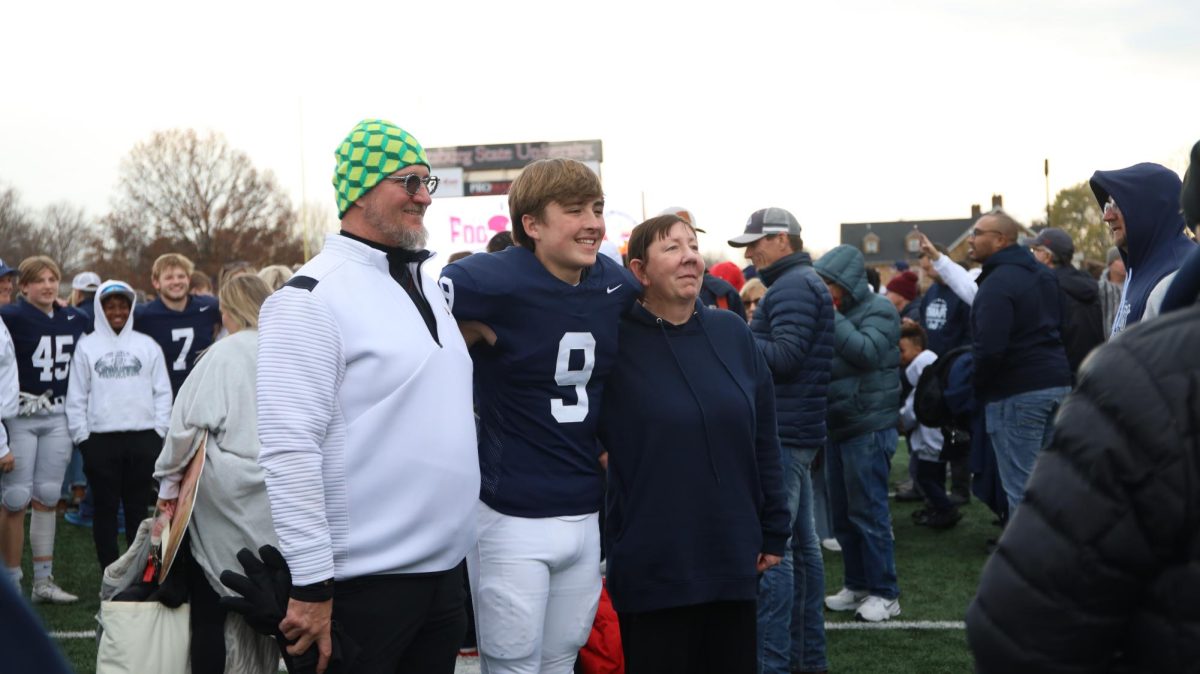 Senior Lincoln Gray poses for a picture with his family. 
