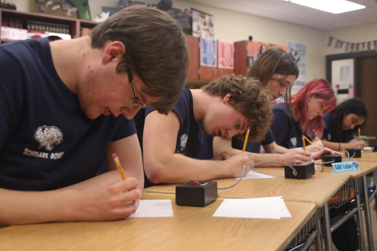 The Scholars Bowl team works to solve a math problem in the finals round. The team competed at Eudora Wednesday, Nov. 15.