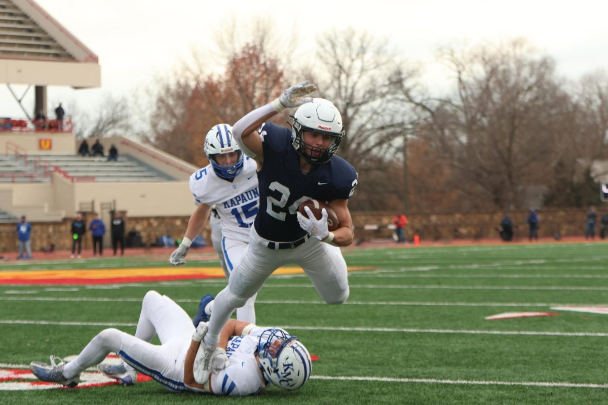 Diving for the first down, senior Jaden Scobee goes airborne. 