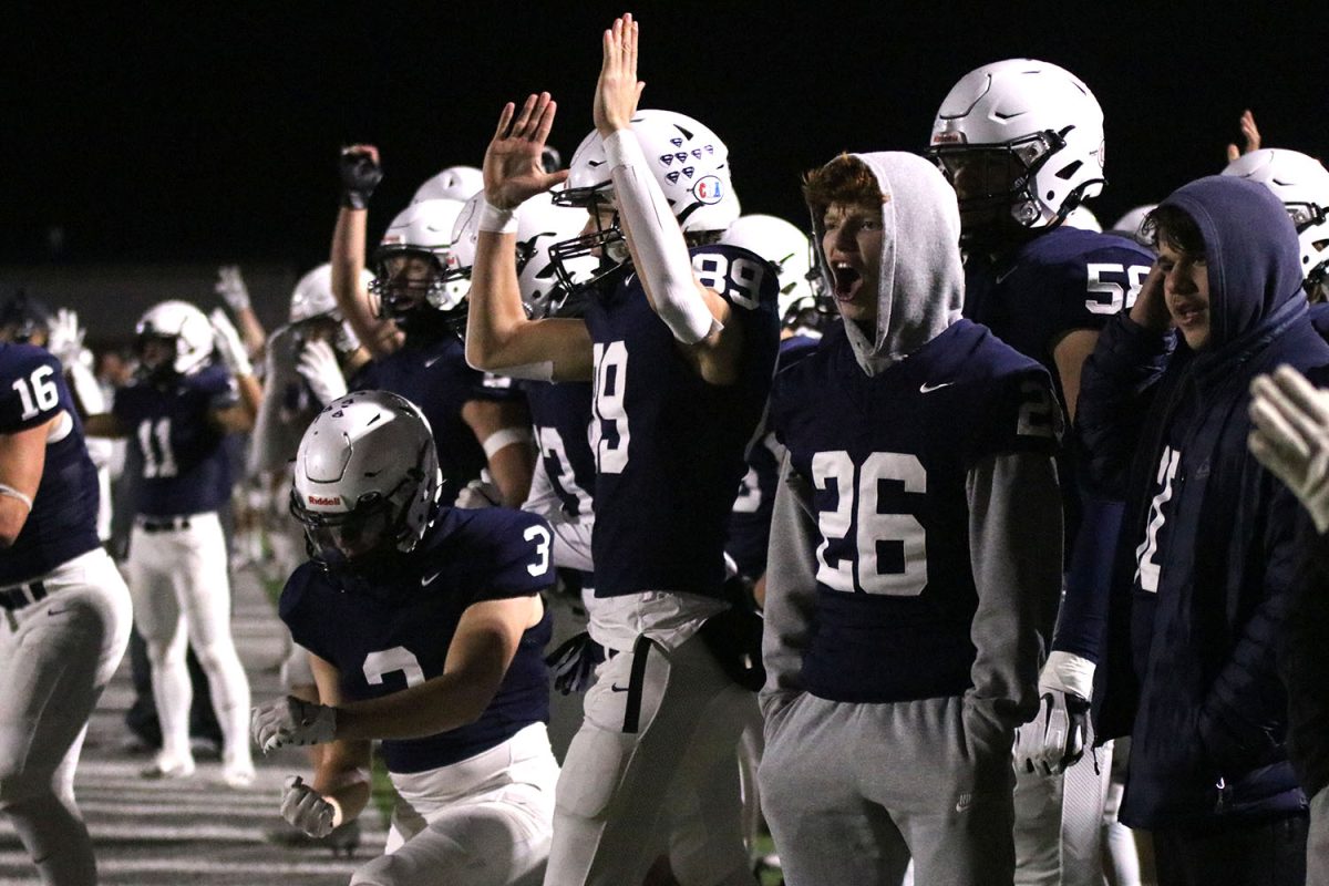Shouts of celebration sound from the sideline as the Jaguar offense runs the ball for a touchdown.
