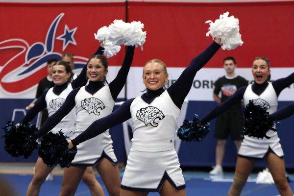  Smiling to the crowd, senior Danika Dulitz strikes a pose. 