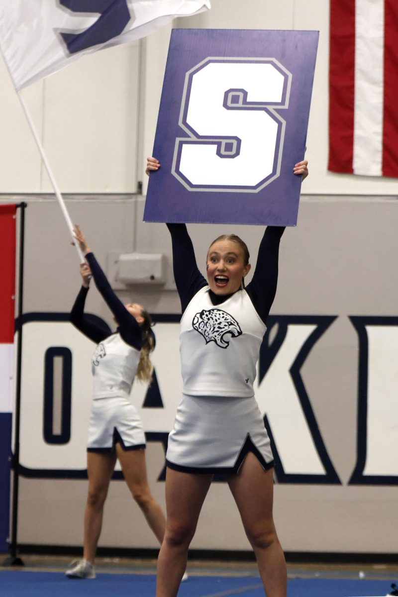 Performing the MVHS chant, senior Jaiden Fisher holds up the letter “S”.
