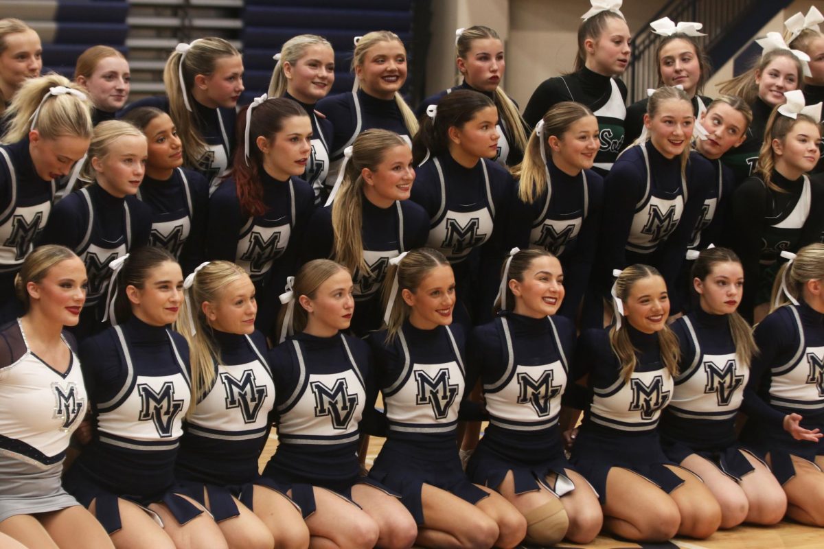 After performing their routines, the team comes together for a group picture.