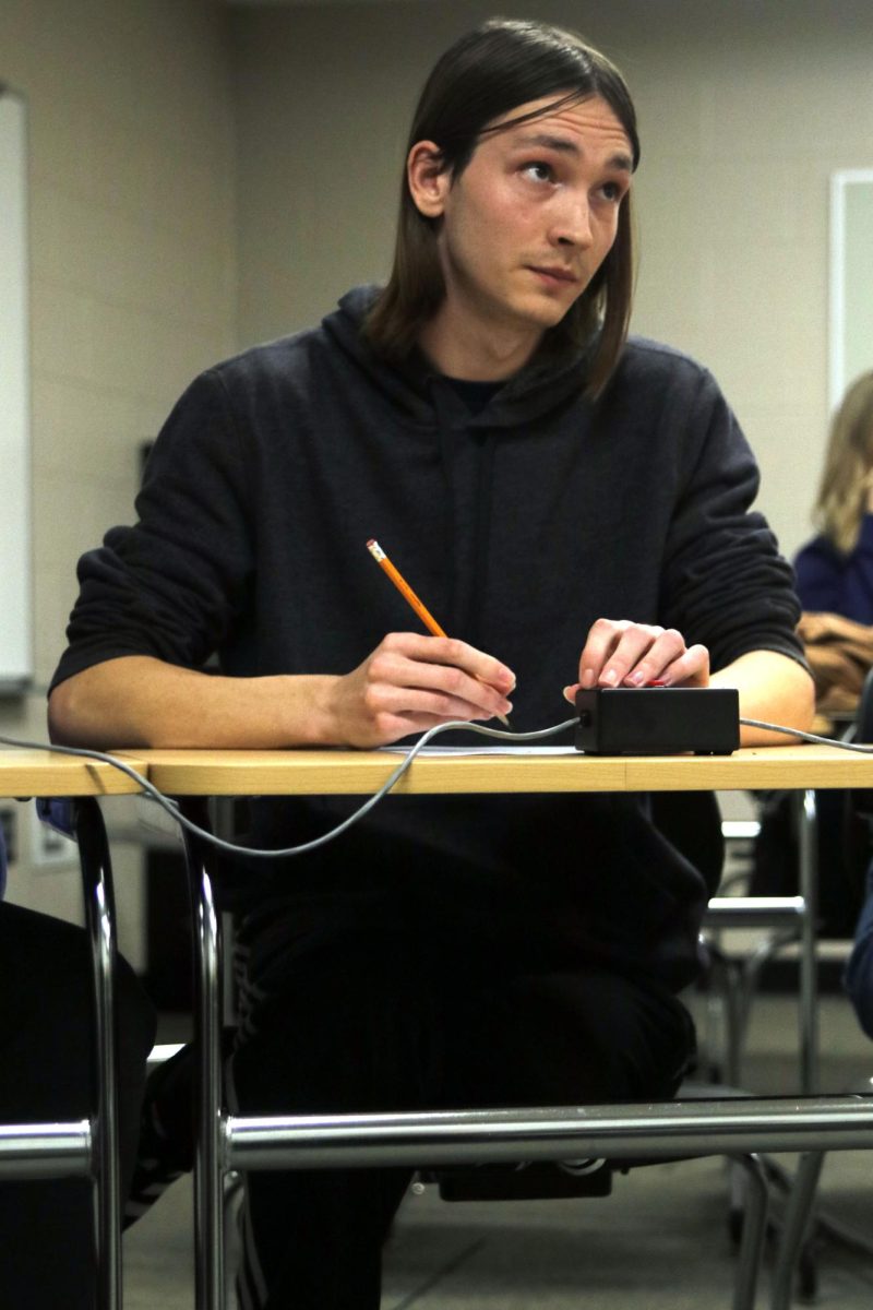 Concentrating, senior Georgia Hansen listens intently to the reading of a math equation.