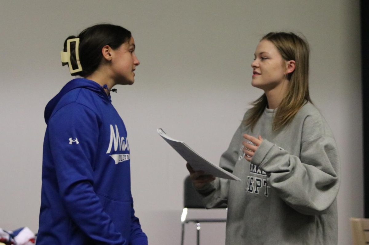 Freshman Lacey Jennings and senior Caroline Alley run through their scene blocking and lines before rehearsal Wednesday, Oct. 18.