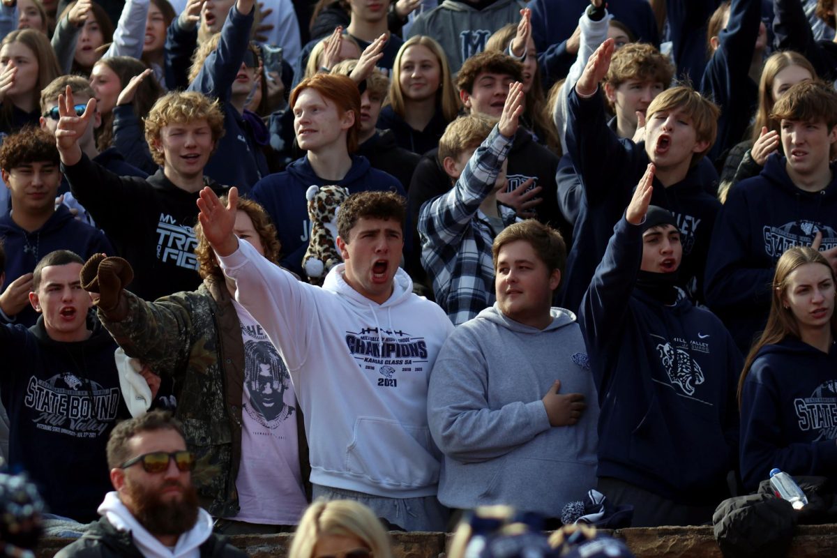 At the end of the national anthem, senior Blake Neis, along with the student section, yells Chiefs.