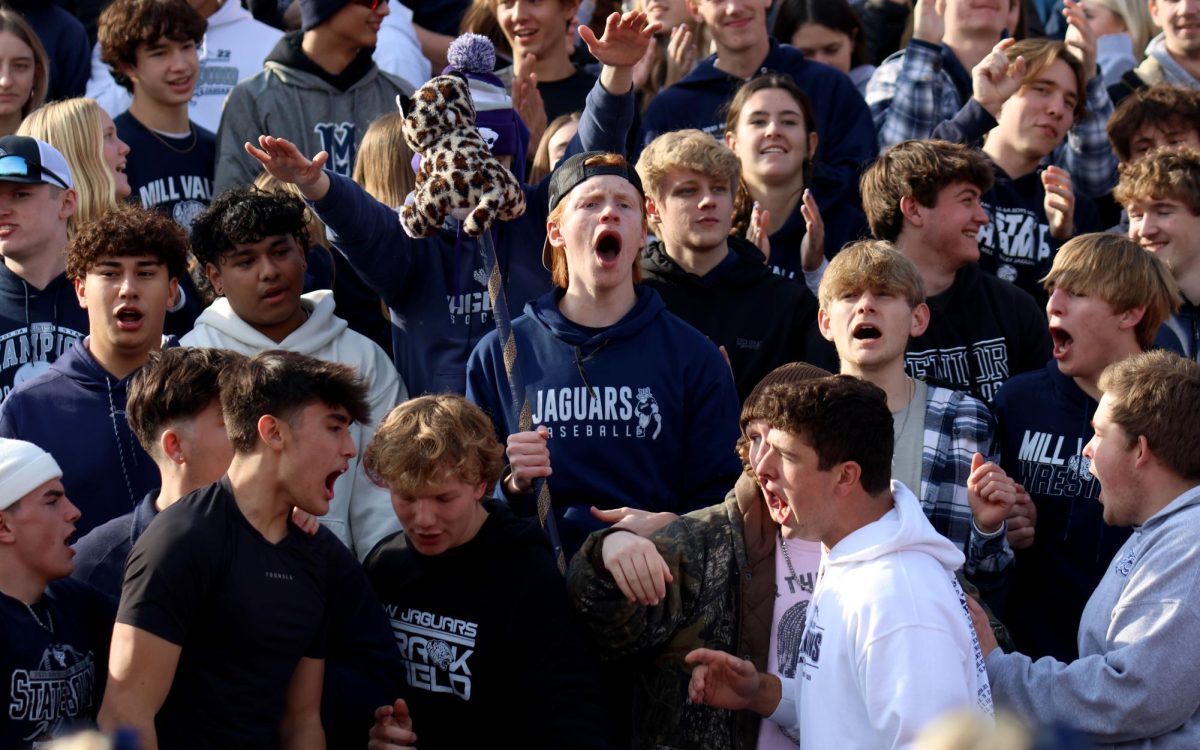 Senior Porte Slattery yells with the student section.