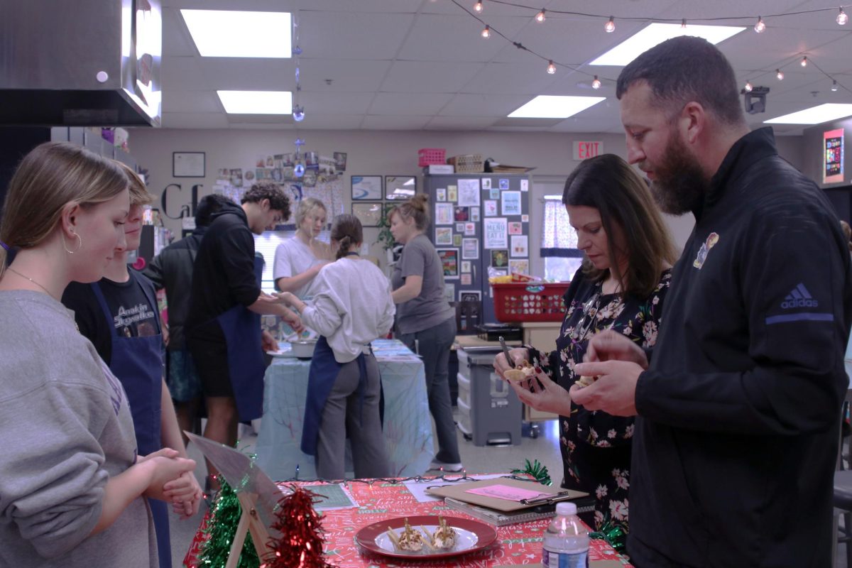 Assistant principals Deborah Jaeger and Brent Bechard enjoy a tasty treat from kitchen 3.