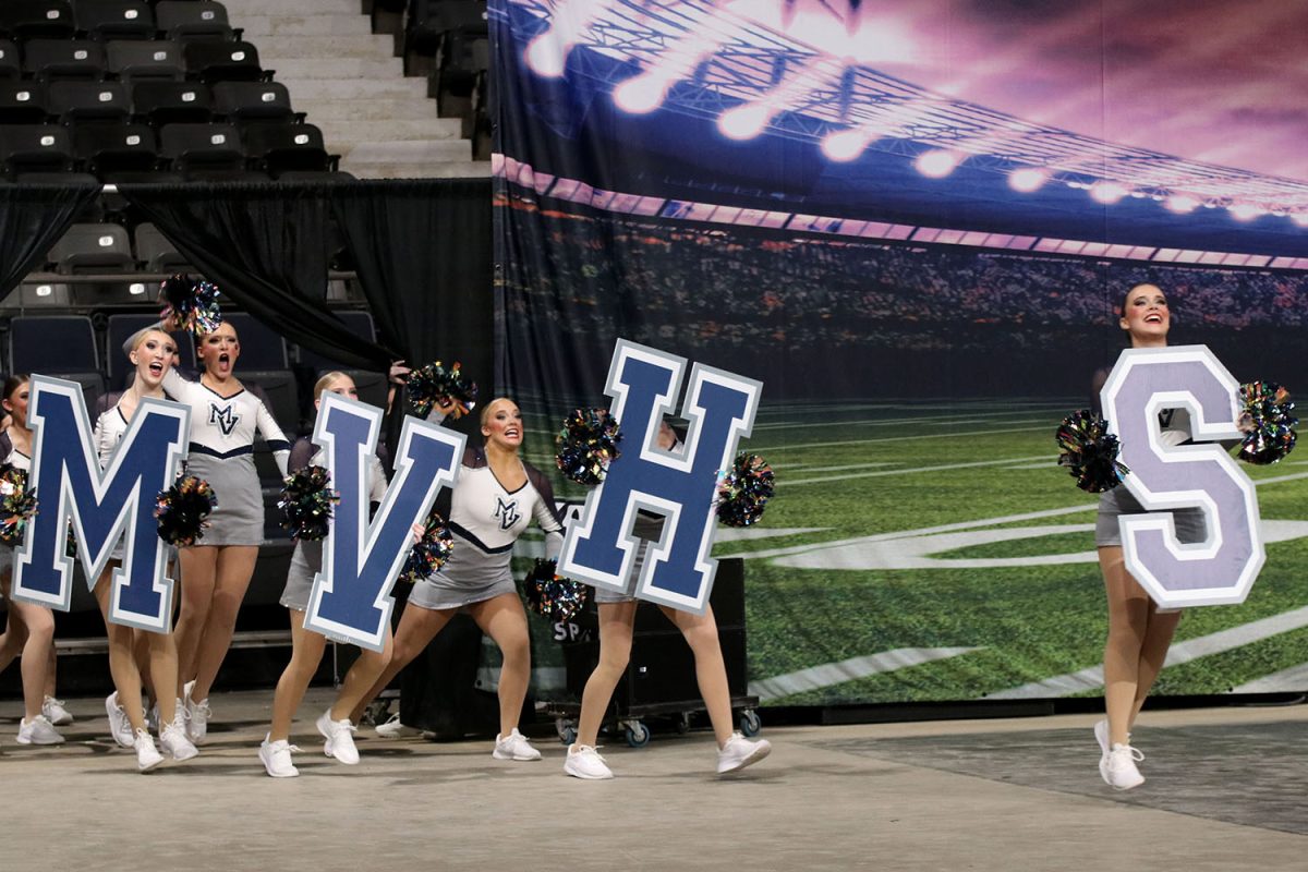 Entering the stage, the Silver Stars prepare to perform their routine. 
