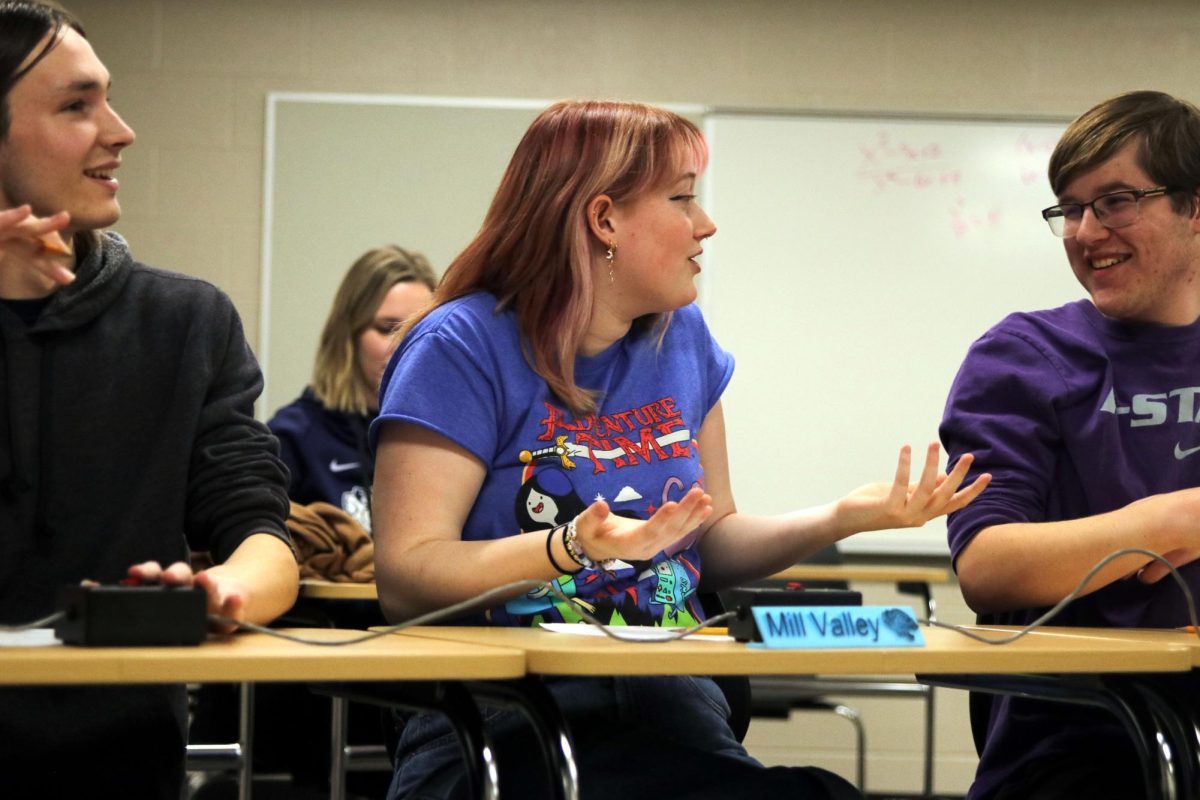 Defending her answer, senior Emma Clement turns to sophomore Ian Weatherman.