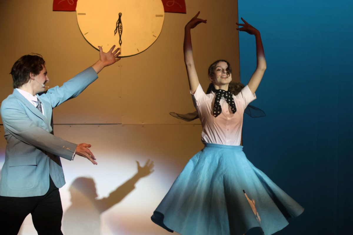 Arms outstretched, Albert Peterson, played by junior Ayden Brown, gestures to Margie, played by senior Sophia Estes, while she dances to “Put on a Happy Face”.