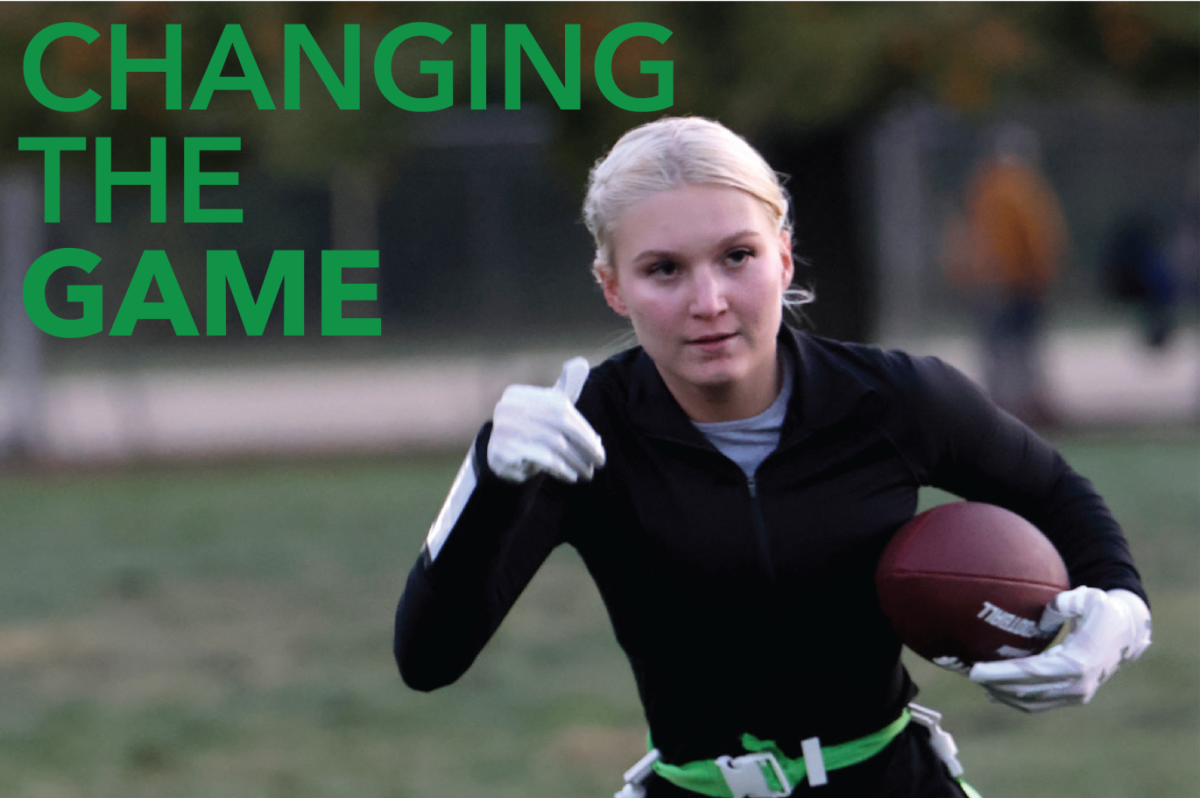 Amidst a hand-off in her second year of flag football practice, senior Emily Summa sets her gaze on the end-zone to score a touchdown Wednesday, Oct. 18 