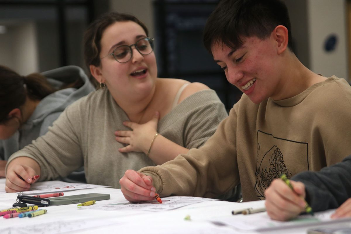 While coloring turkeys, seniors Guss Miller and Jules Shumaker have a good conversation at Clubsgiving.