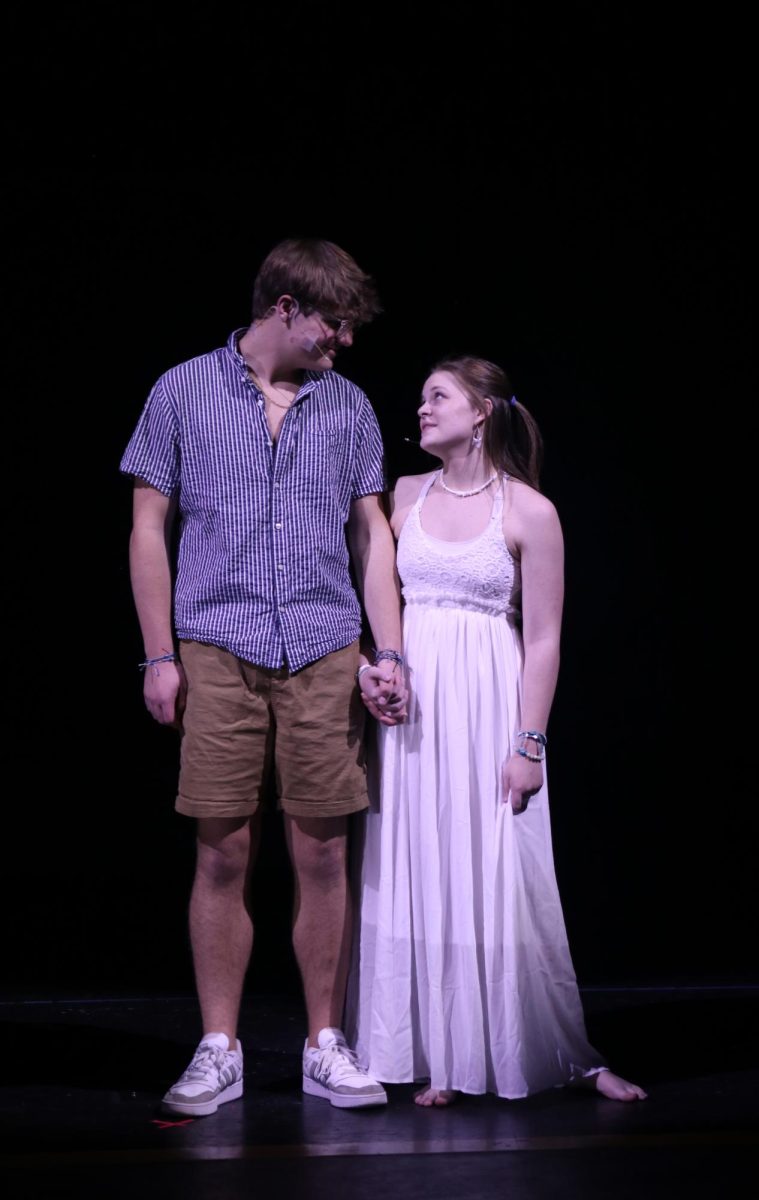 Looking into each others eyes, Skye and Sophie, played by seniors Blake Powers and Caroline Alley, sing “I Have a Dream.”