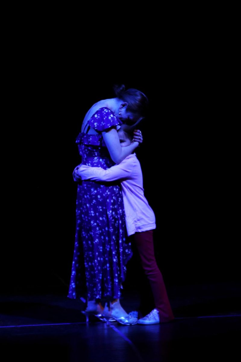 Wrapping their arms around each other, young Sophie and Donna, played by Maddie Cormany and senior Grace Cormany, share a big hug.