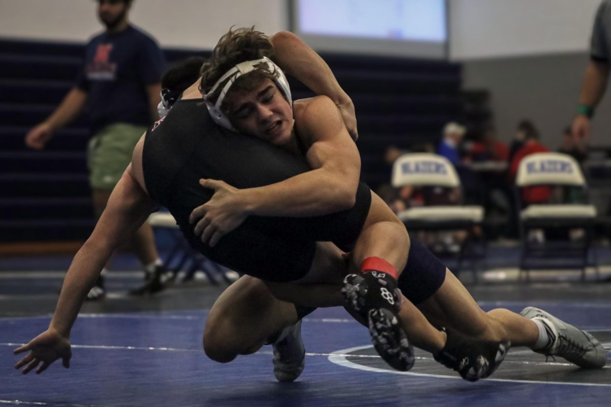 Grabbing his opponent, senior Brady Mason returns him to the mat.