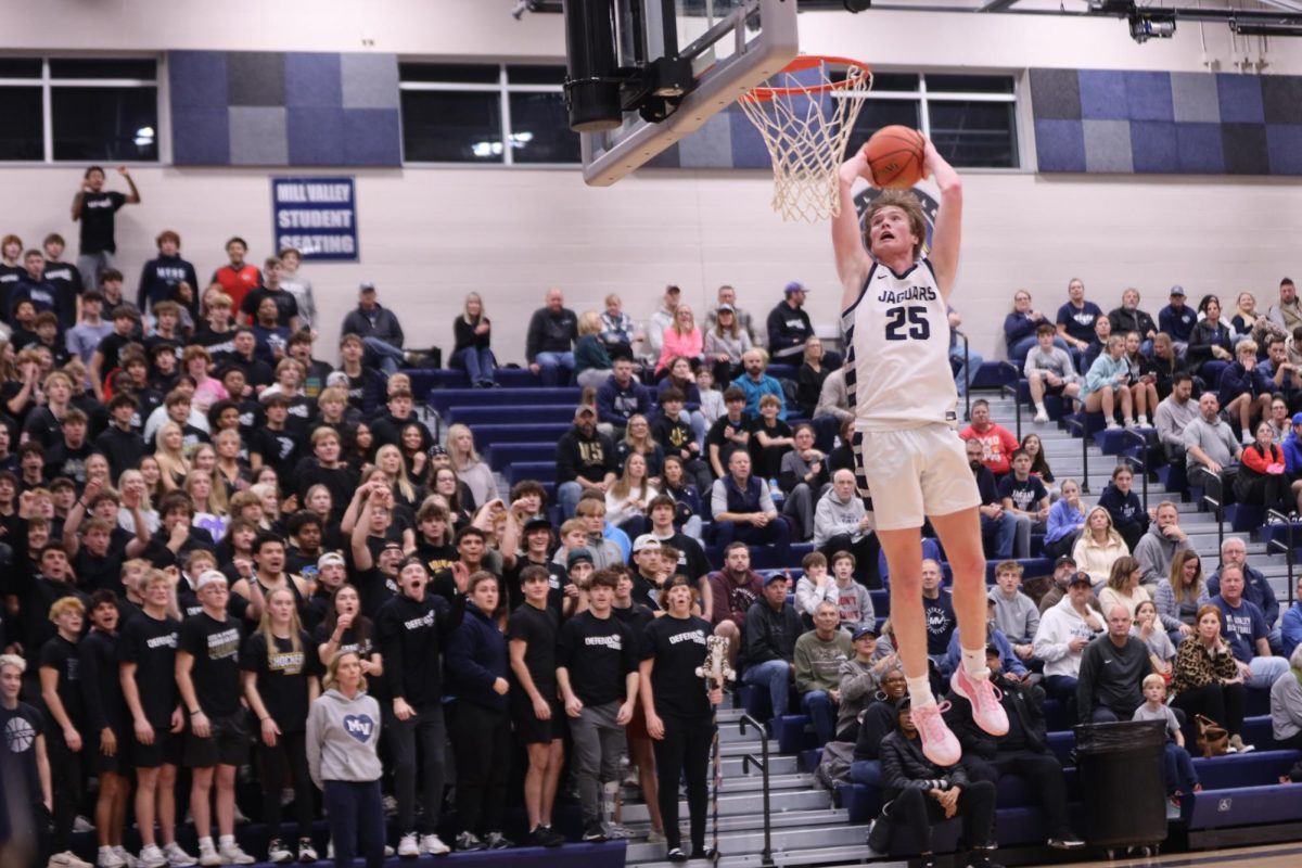 After stealing the ball, junior Carter Kaifes goes up for a dunk.