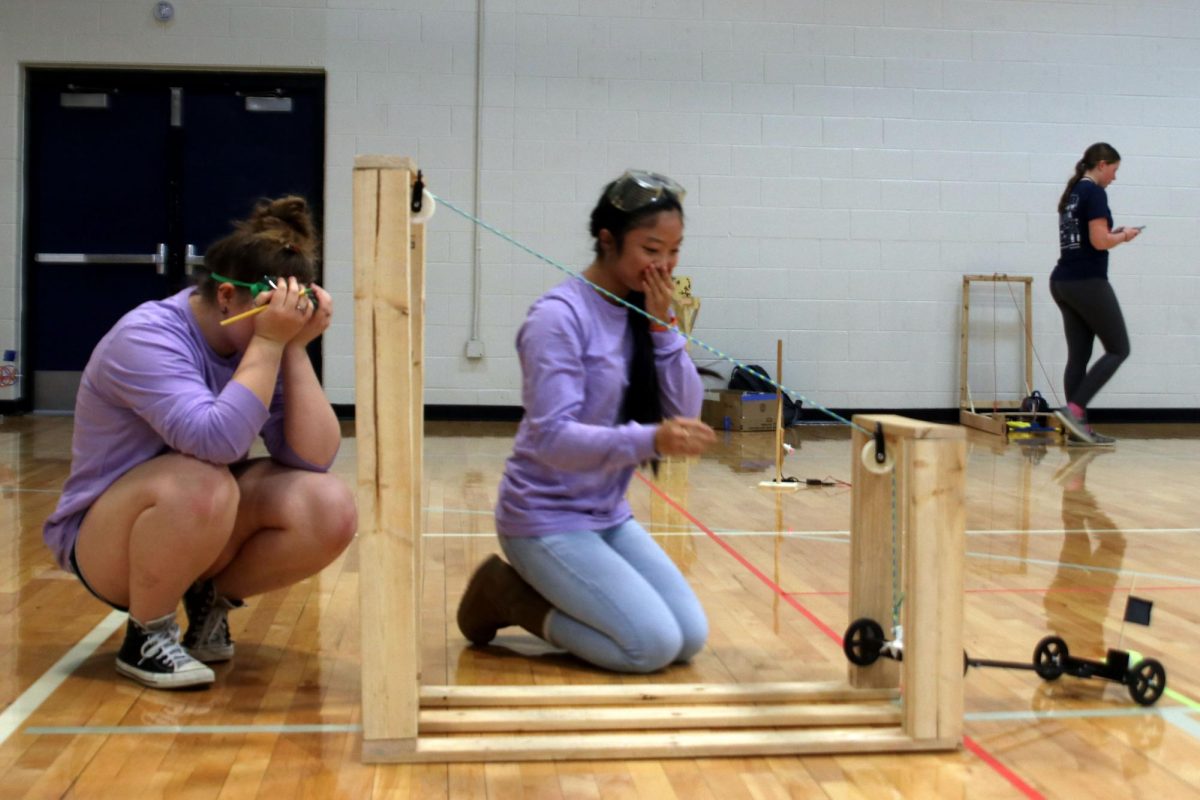 Juniors Hannah Lewis and Alivia Thatlor react after their Scrambler event does not go as planned.