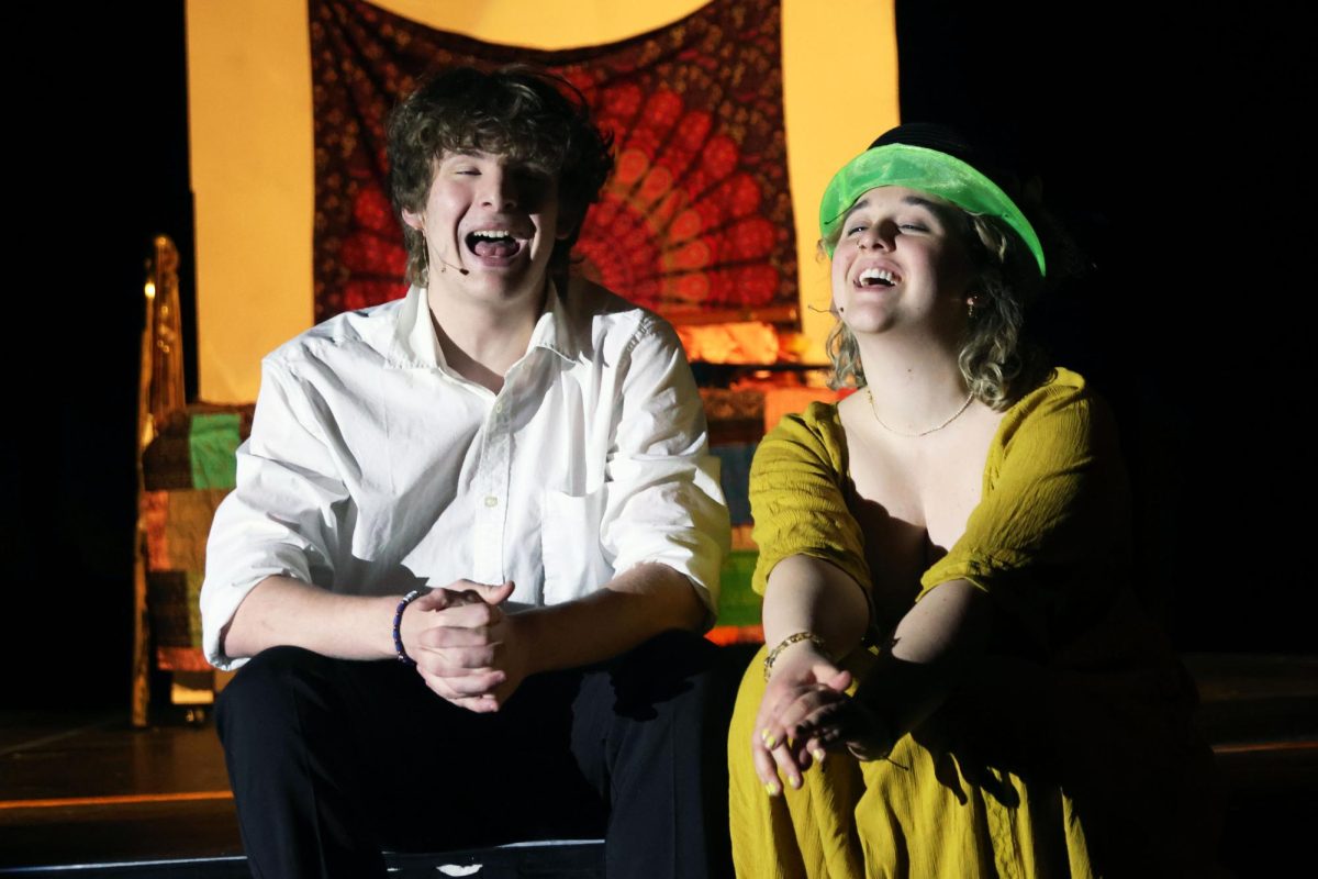 Sitting closely on the stage stairs, Harry and Donna, played by junior Ayden Brown and senior Riley Martin, sing “Our Last Summer”. 