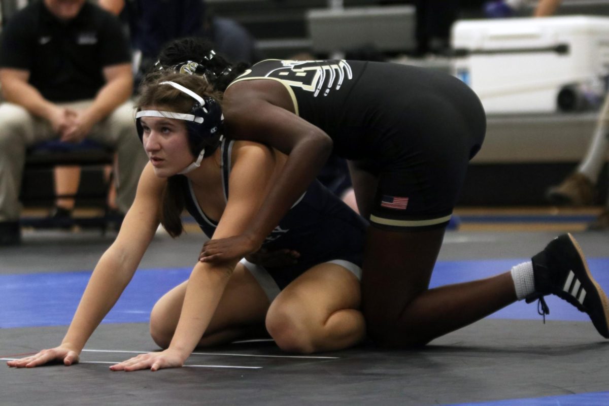 While her opponent prepares to make her move, junior Jule Kohorst sits on the ground and listens for the referee to blow the whistle. 