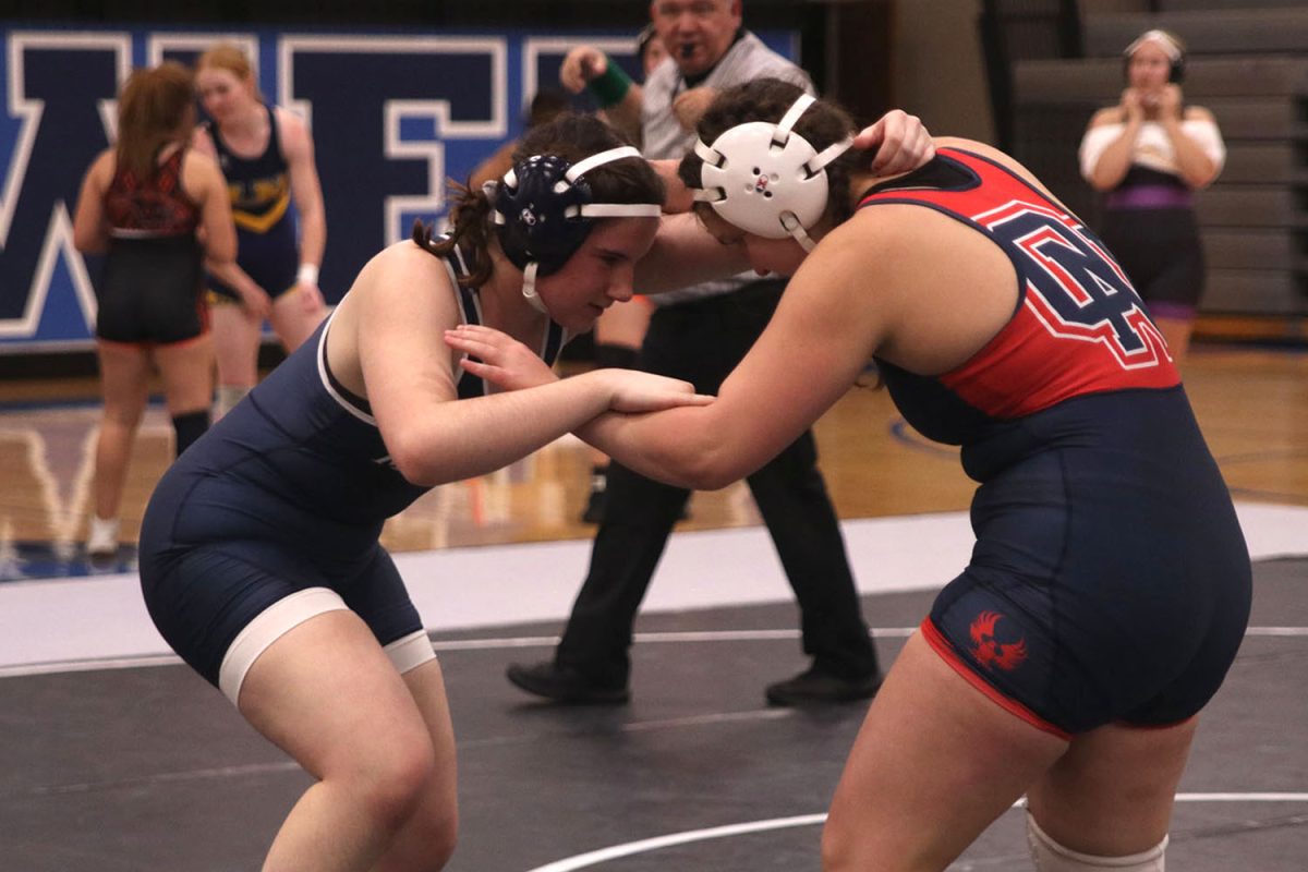 To start the match, junior Lexus Pennel gets ready to take down her opponent. 