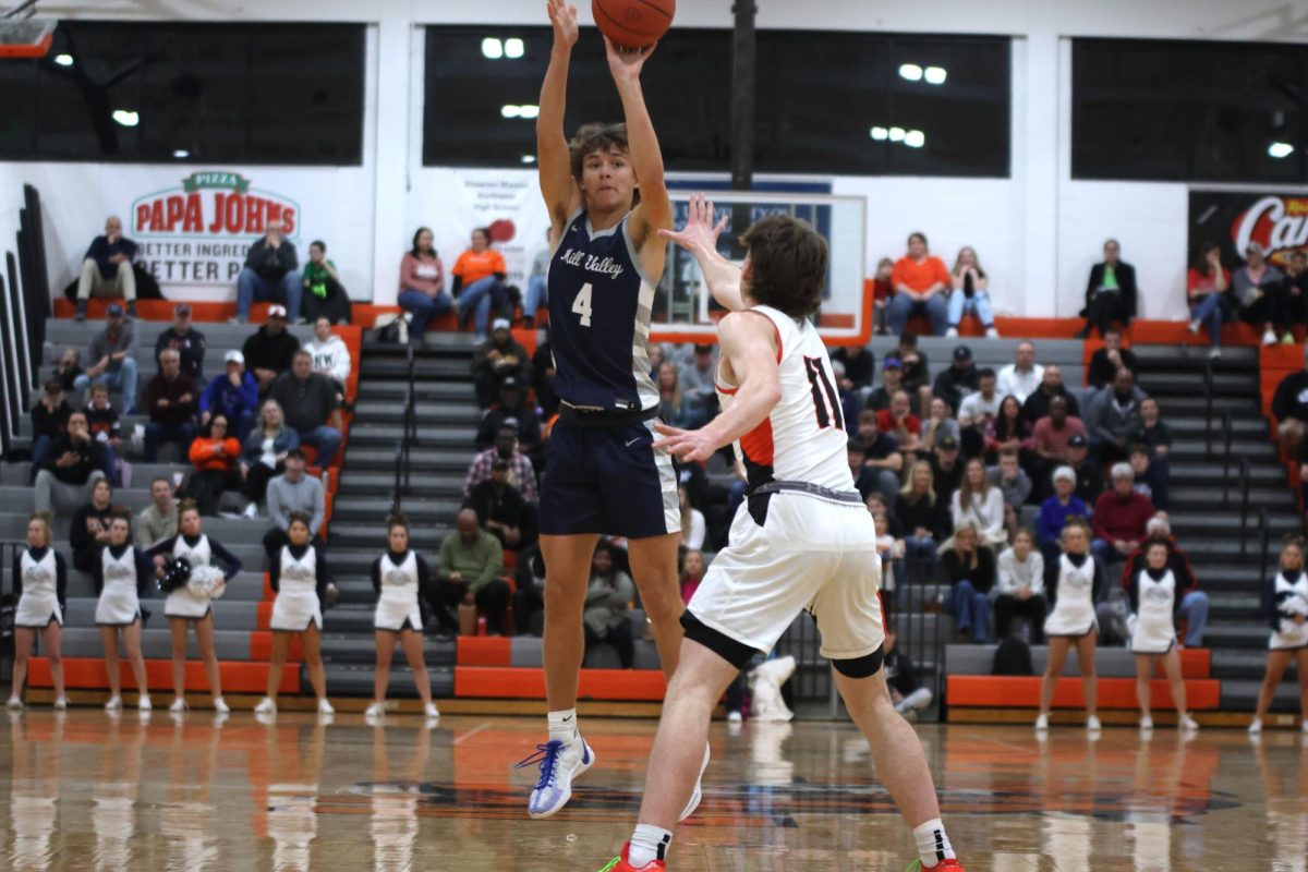 Sophomore Reece Riedel shoots the ball.