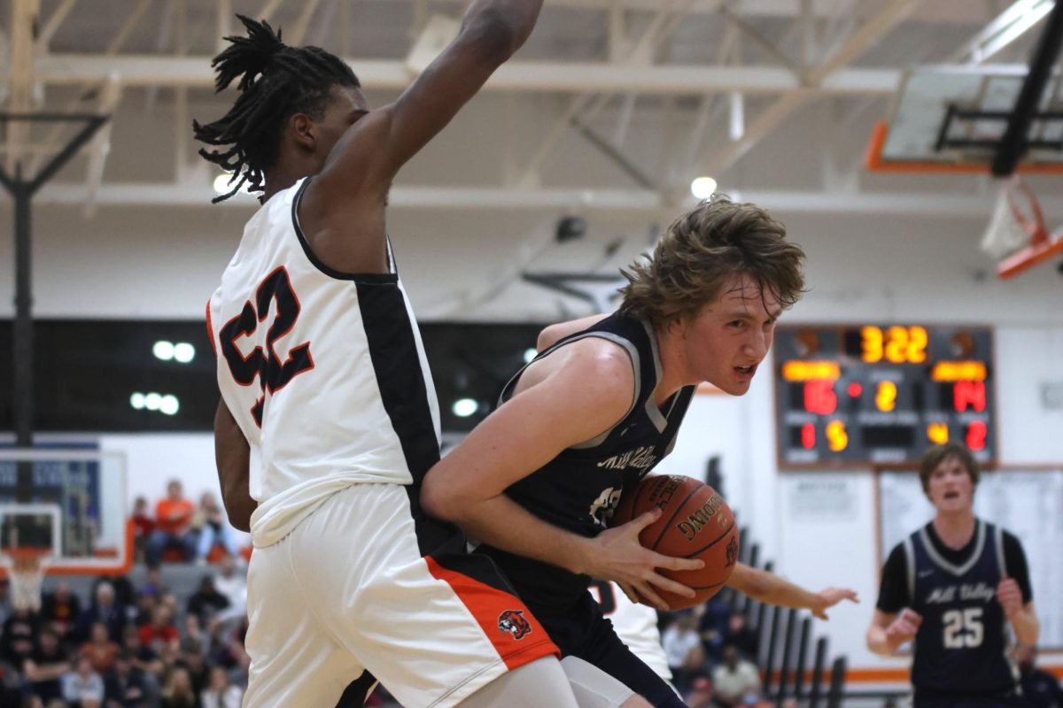 Senior Mason Kemp drives his body to the basket.