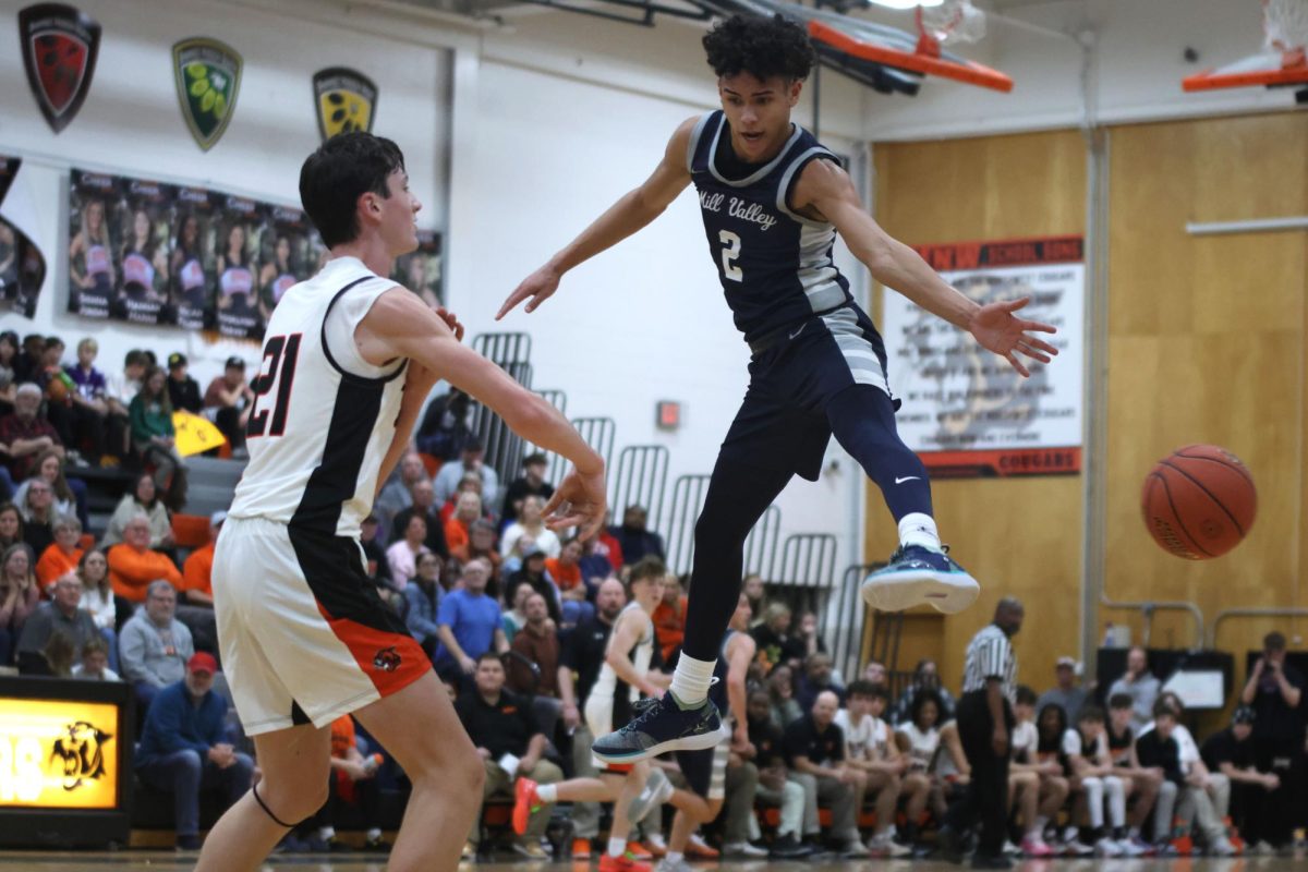 Sophomore JaKhai Carter jumps up in an attempt to block a pass.