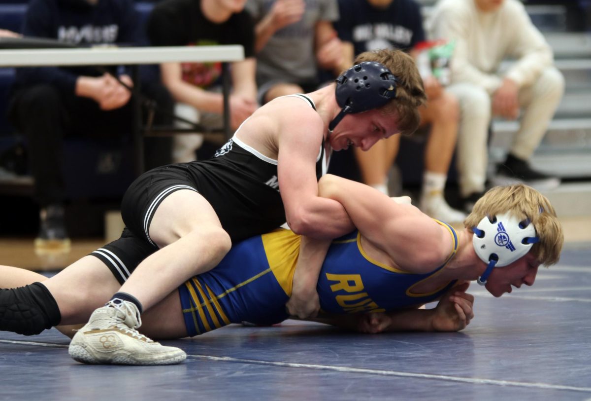 Preventing his opponent from moving, sophomore Jeredy Nilges keeps his opponent pinned down.