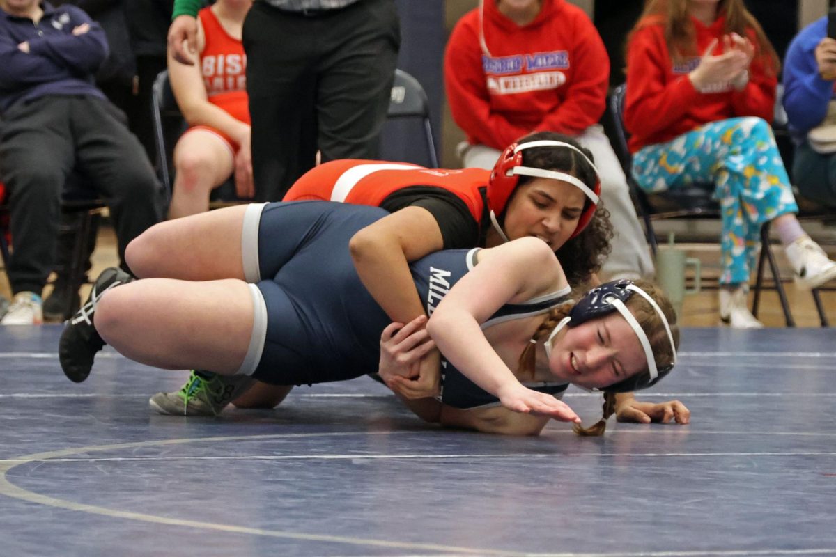Focused, junior Cadence Kerr attempts to break free from her opponent.